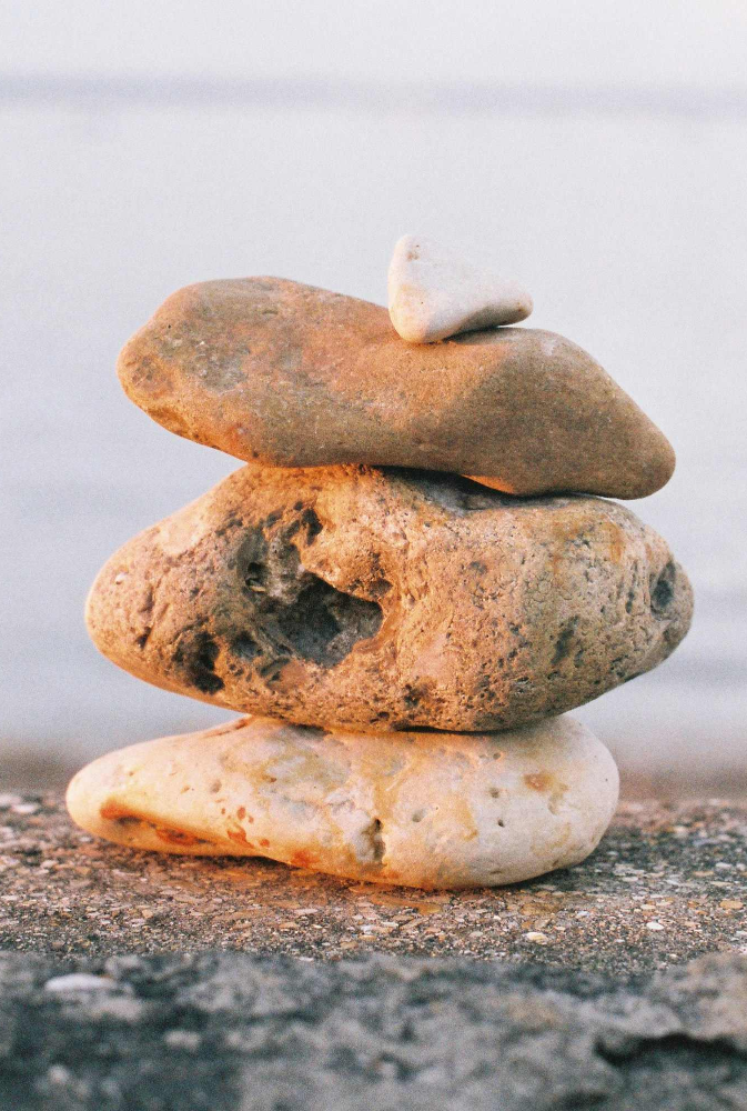 pile of stones. professional development coaching norwich norfolk peak performance hr