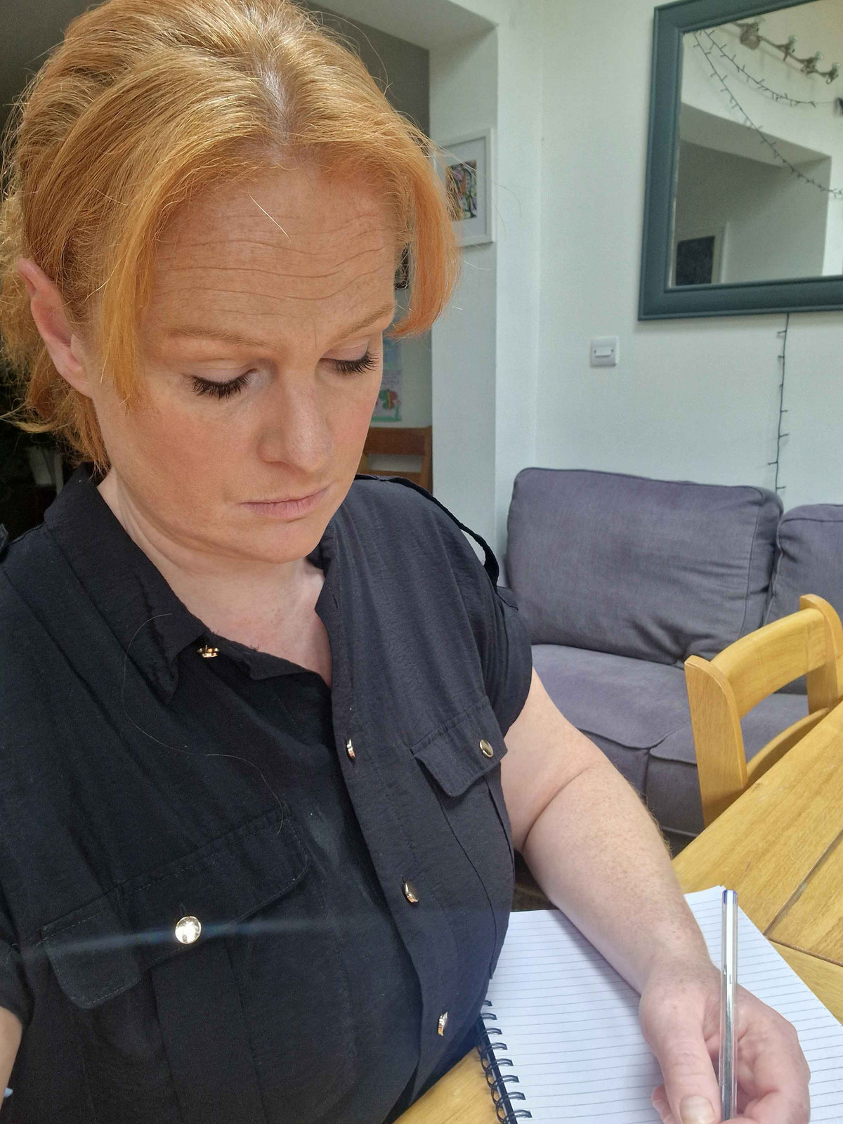 lady writing in a notebook. HR Consultancy in Norfolk for Organisations 