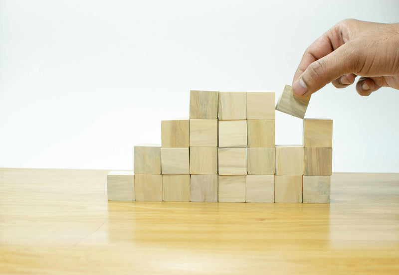 pile of building blocks. leadership development coaching in norwich norfolk peak performance hr