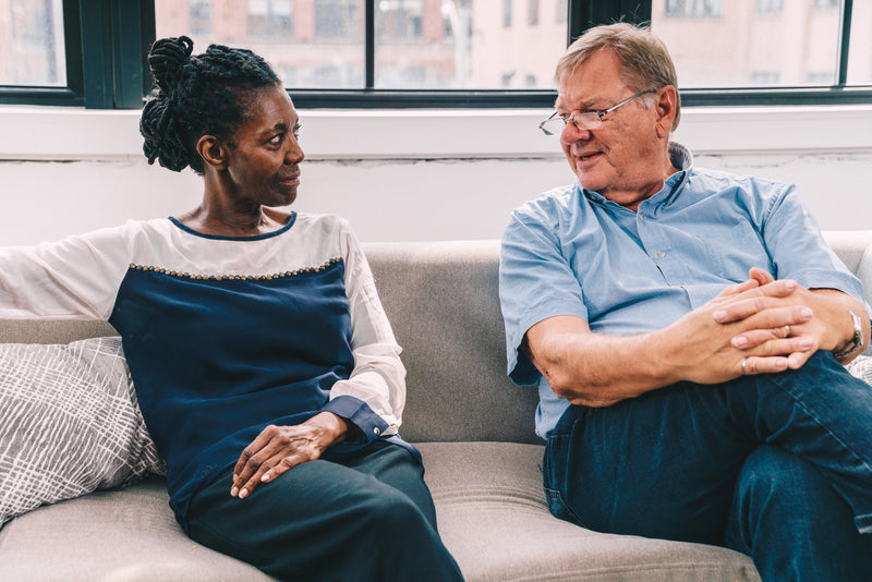 senior man and lady chatting on sofa linkedin review and support norwich norfolk eak performance hr
