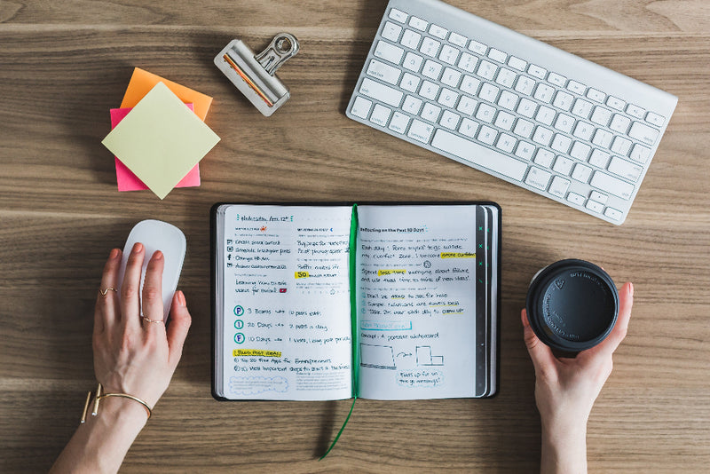 notebook open with office supplies and keyboard workplace resilience workshop Norwich Norfolk peak performance hr